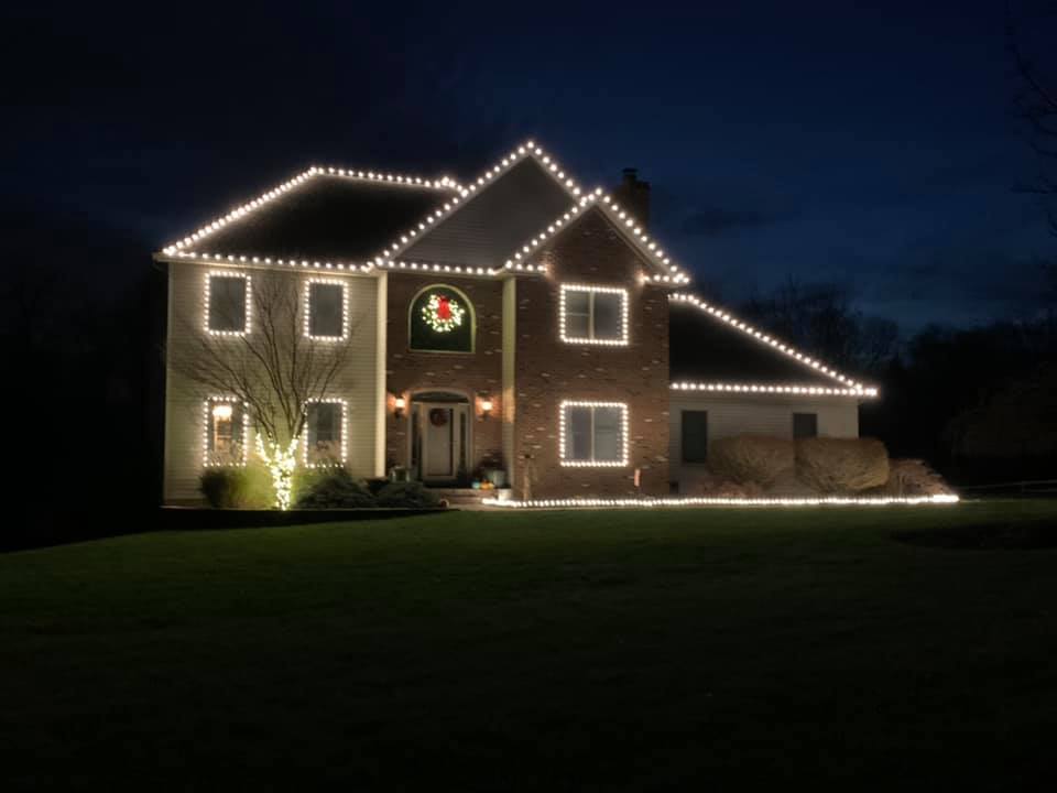 large house with lights strung around it